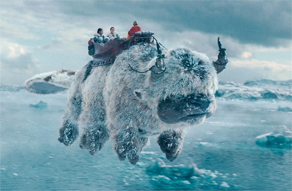 Three people sit in a saddle atop a large, white, furry creature flying over a frozen, icy ocean.