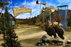 Cartoon characters and a large bear in a campsite setting with a sign reading Camp Kidney.