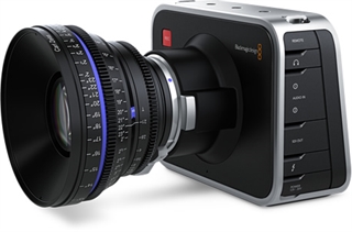 A black and silver digital cinema camera body with a large, professional cine lens attached.