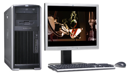 A silver and black computer tower next to a monitor, keyboard, and mouse on a white background.