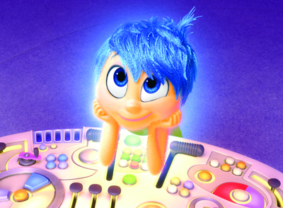 Animated blue-haired character with large eyes resting chin on hands over a glowing control console.