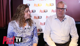 A woman with curly hair and a man in a light shirt sit in front of a Post TV logo backdrop.