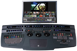 A large video editing control surface with various knobs, buttons, and a monitor showing video clips.