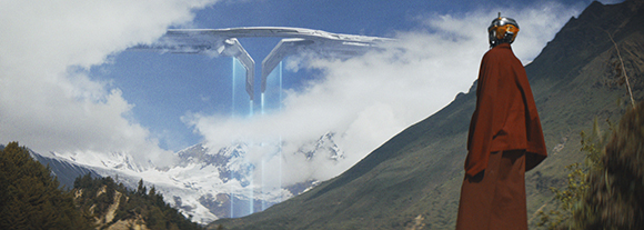 A person in red robes watches a large, futuristic white structure hovering above clouds and mountains.